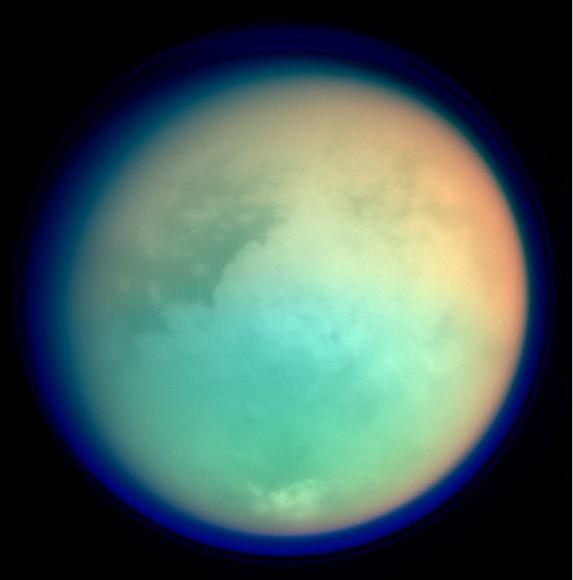 This is a false colour image of Saturn's moon, Titan. It's assembled from 4 images from the Casinni probe. The colours in the image represent infrared (red and green) and ultraviolet (blue). This elegantly demonstrated how some wavelengths are more opaque than others and how this changes due to atmospheric composition. The red and green colours show areas where methane in the atmosphere is absorbing IR radiation and the blue shows the height of the atmosphere and detached hazes. Image Credit: NASA/JPL/Space Science Institute.